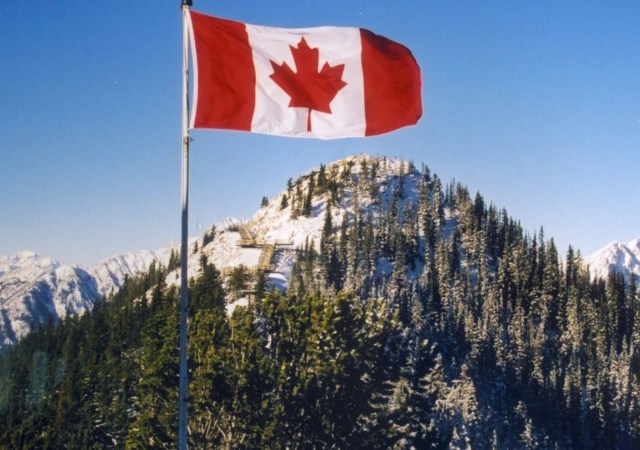 canadian flag and mountains